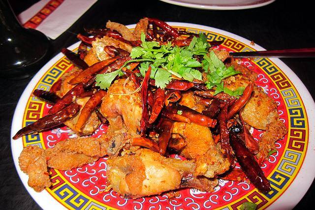 The $10 Chongqing Chicken Wings, served with fragrant chili and crispy beef tripe
